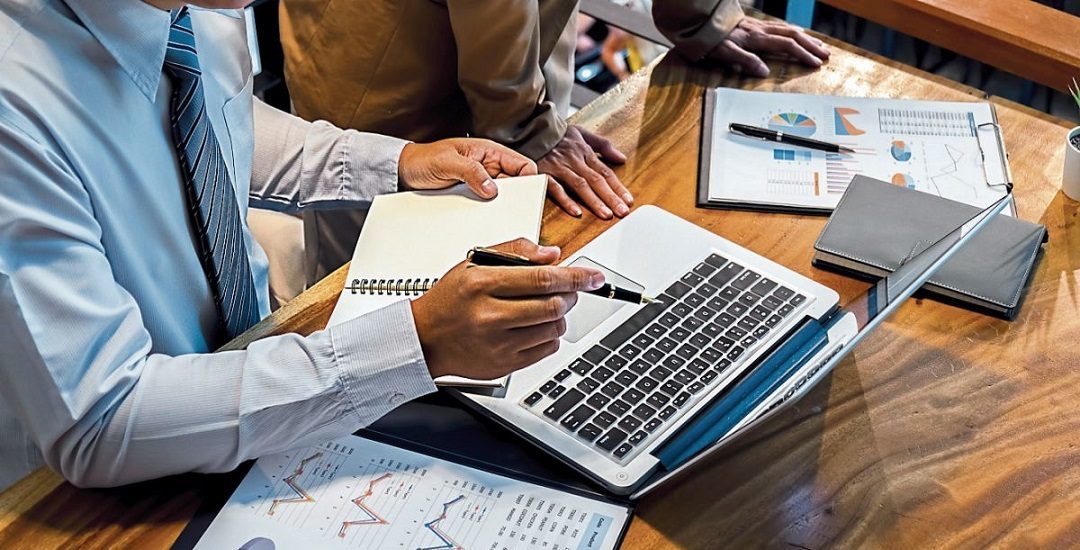 Administrator business man financial inspector and secretary making report calculating balance. Internal Revenue Service checking document. Audit concept