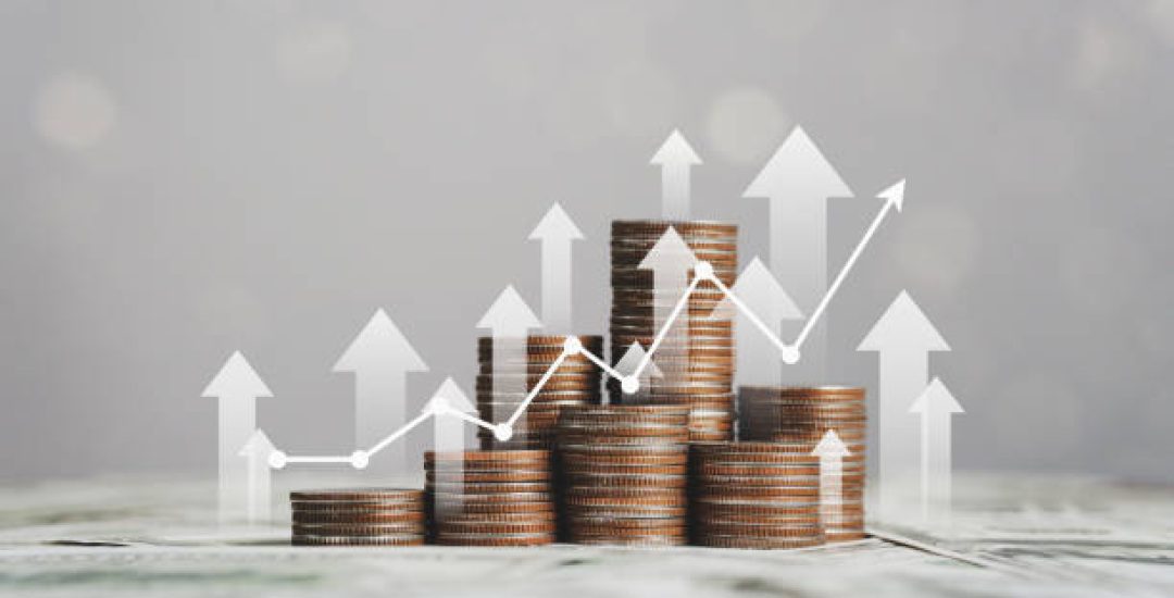 stack of silver coins with trading chart in financial concepts and financial investment business stock growth