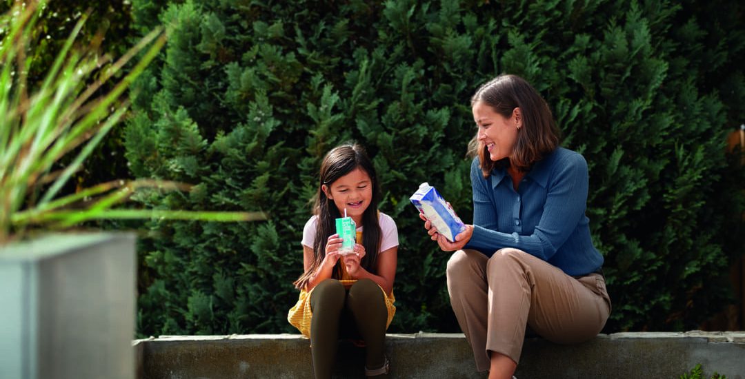Food_woman-child-with-carton-outside_2021_1