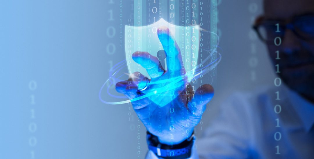 Man touching a padlock shield icon