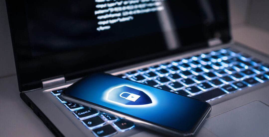 Phone lock to protect from cyber scam, online data fraud or identity theft. Laptop with hacker virus code in screen. Phishing, cybersecurity danger or ransomware attack. Encrypted privacy in email.