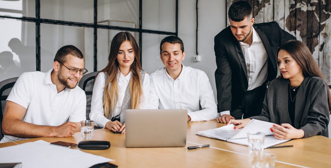 Group of people working out business plan in an office