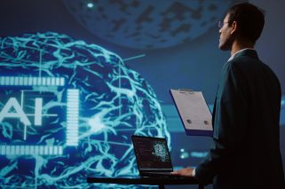 Startup employee looking over business charts, using AI software to take data driven decisions in tech industry. IT expert developing innovative artificial intelligence solutions for company, camera B