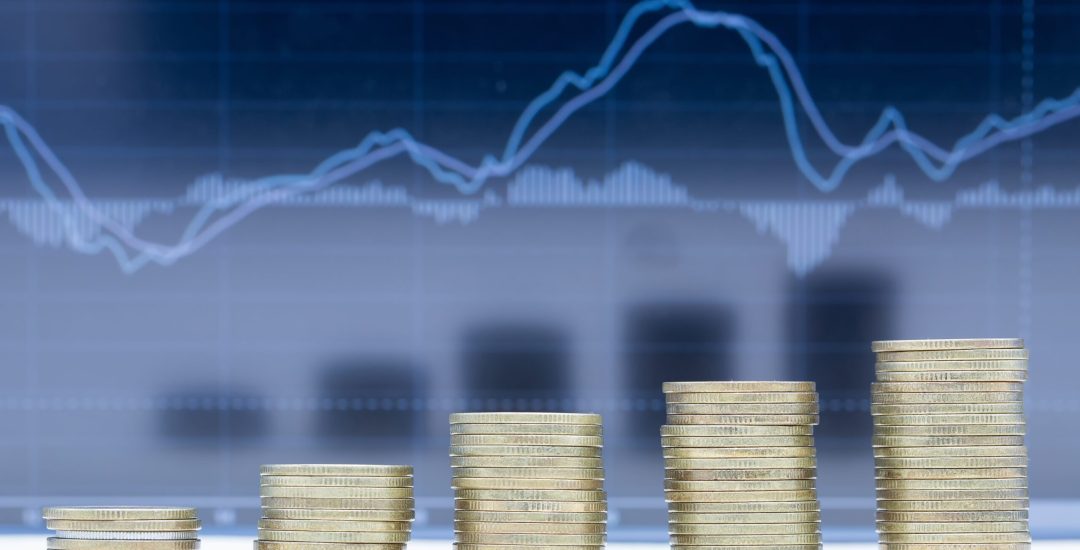 A stack of five rows of coins with graph dark blue background.
