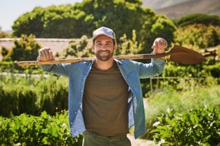 Man, farmer portrait and shovel outdoor, gardening and sustainability project for organic soil. Male person, agriculture and spade for plant harvest in nature, agro confidence and farm for growth.