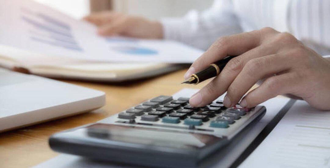 Cropped Image Of Businesswoman Working On Desk