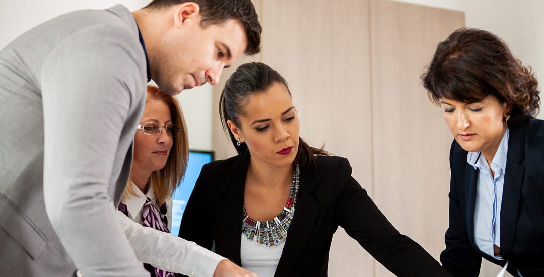 Business people working as a team in conference room. Plans for the future.