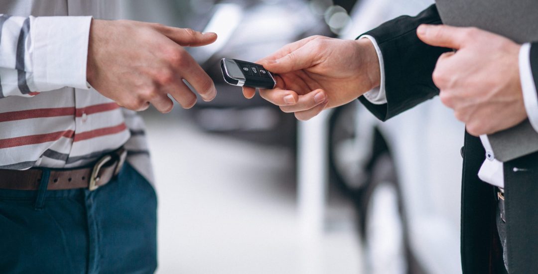 Female hands close up with car keys
