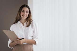 front-view-elegant-businesswoman-holding-clipboard-with-copy-space