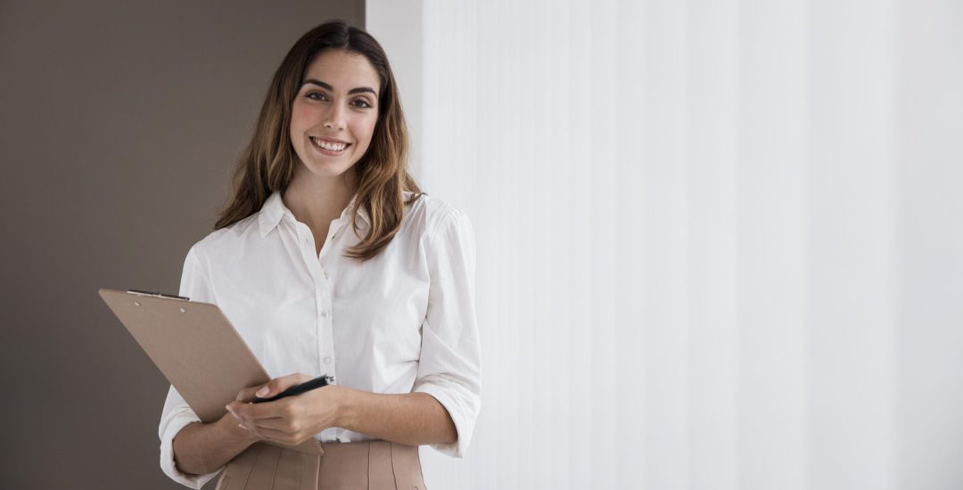 front-view-elegant-businesswoman-holding-clipboard-with-copy-space