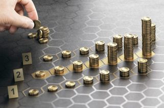 Human hand stacking generic coins over a black background with hexagonal golden shapes. Concept of investment management and portfolio diversification. Composite image between a hand photography and a 3D background.