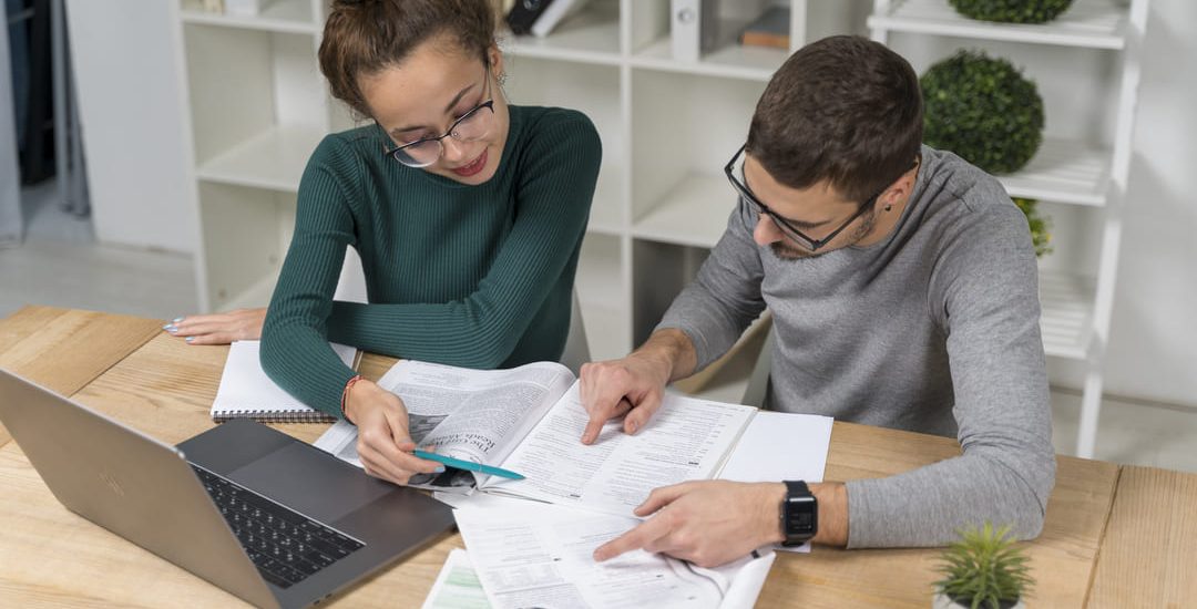 high-angle-students-studying-together