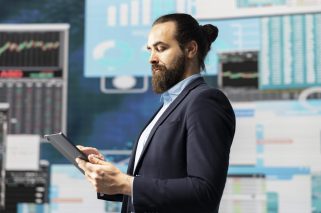 Conceptual image showcasing businessman in a digital environment focused on metrics, strategic planning and profitability through technology and analytics. Insightfulness and forecasting.