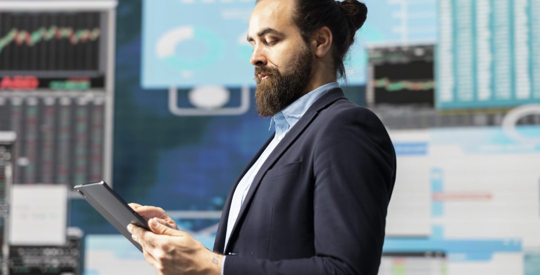 Conceptual image showcasing businessman in a digital environment focused on metrics, strategic planning and profitability through technology and analytics. Insightfulness and forecasting.