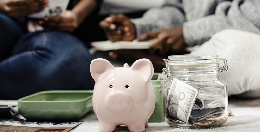 Mother teaching her daughter about savings