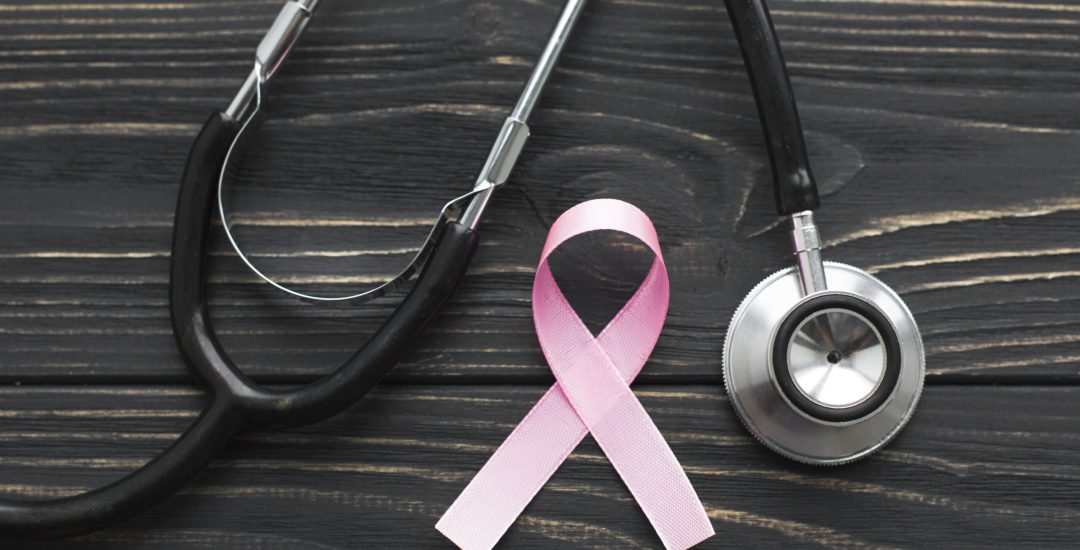 pink-ribbon-and-stethoscope-on-dark-background