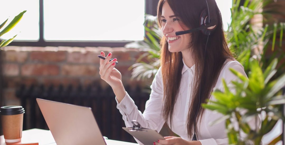 Woman working in call center as dispatcher