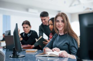 Positive mood. Group of young people in casual clothes working in the modern office.