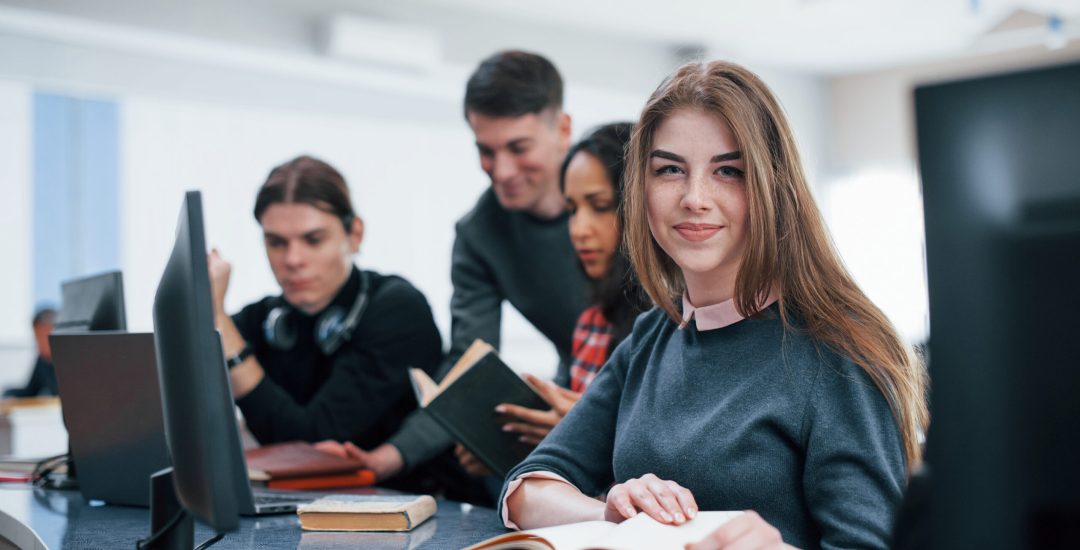 Positive mood. Group of young people in casual clothes working in the modern office.