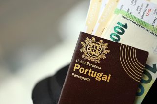 red-portugal-passport-of-european-union-with-money-2024-11-29-18-24-49-utc