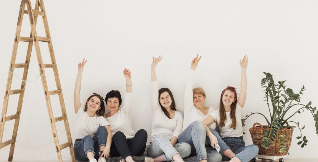togetherness-group-of-women-with-hands-in-the-air